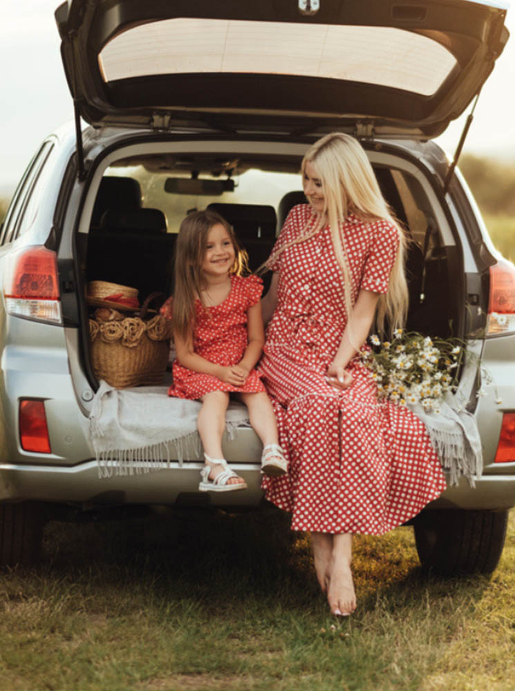 Mother and daughter wearing matching red polka dot dresses - https://krupainsurance.com